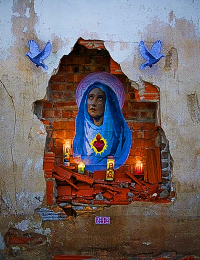 An urban decay altar in Galveston, Texas. The Virgin Mary, by artist 2:12 (photo courtesy Stencil History X)