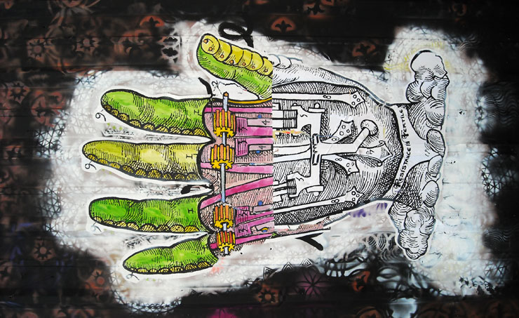 A mechanized hand combines industrial revolutionary diagrammatic style with a surreal quality of modern possibility. From a mural done with NOLA Rising (Buxtonia)