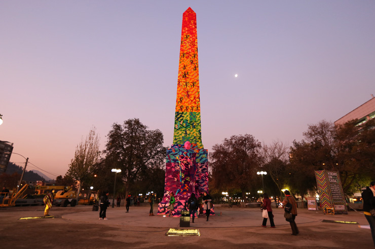 Olek Patiently Awaits to Erect Rainbow Obelisk in Santiago, Chile