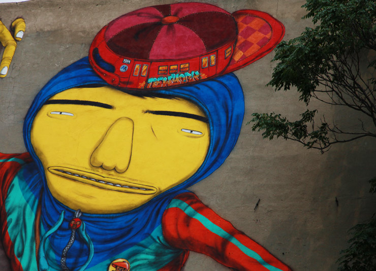 OS Gemeos Pop Through Walls Downtown NYC, Screens in Times Square