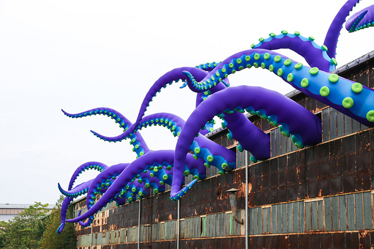 Surreally Giant Tentacles Waving from a Warehouse in Philadelphia